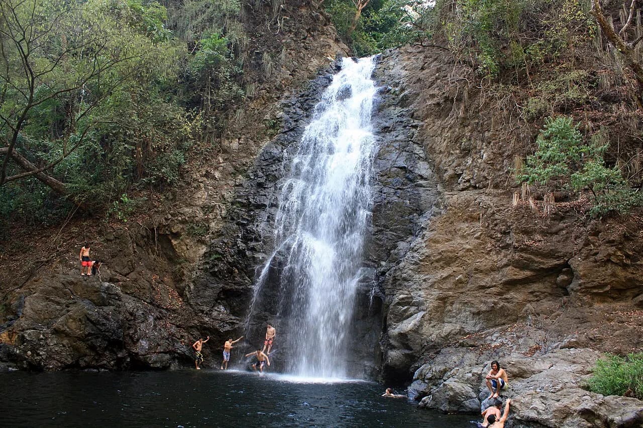 Montezuma waterfall dropping over a rocky face into a natural pool