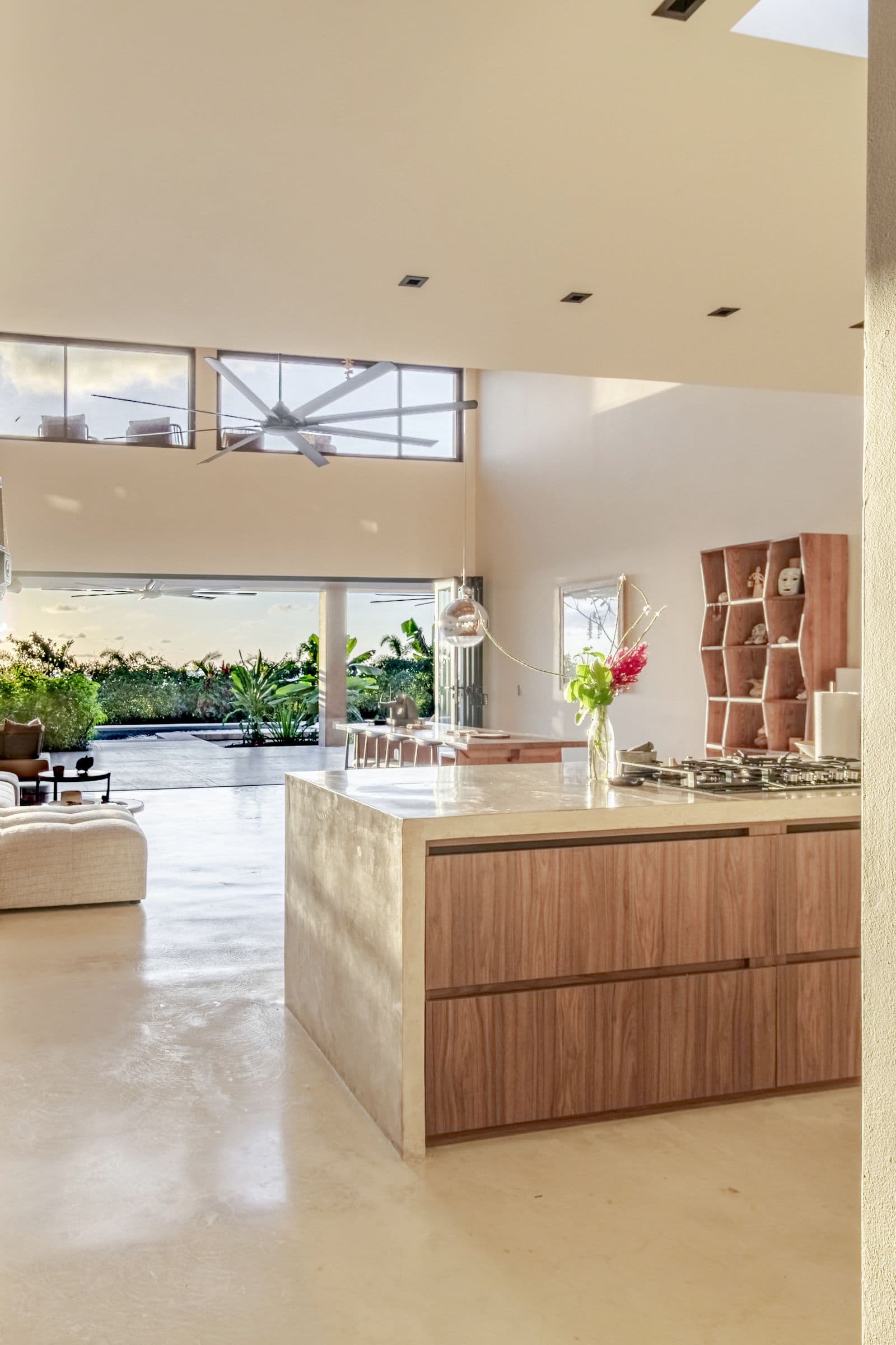 Front door opening onto the kitchen, living area and garden beyond