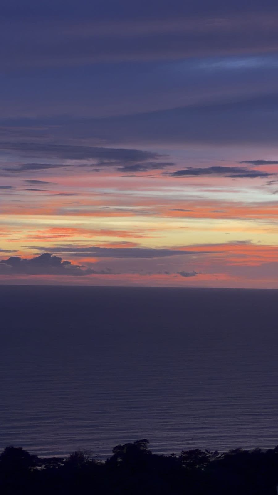Pink and violet sunset over the Pacific Ocean, filmed from Villa Raya’s rooftop