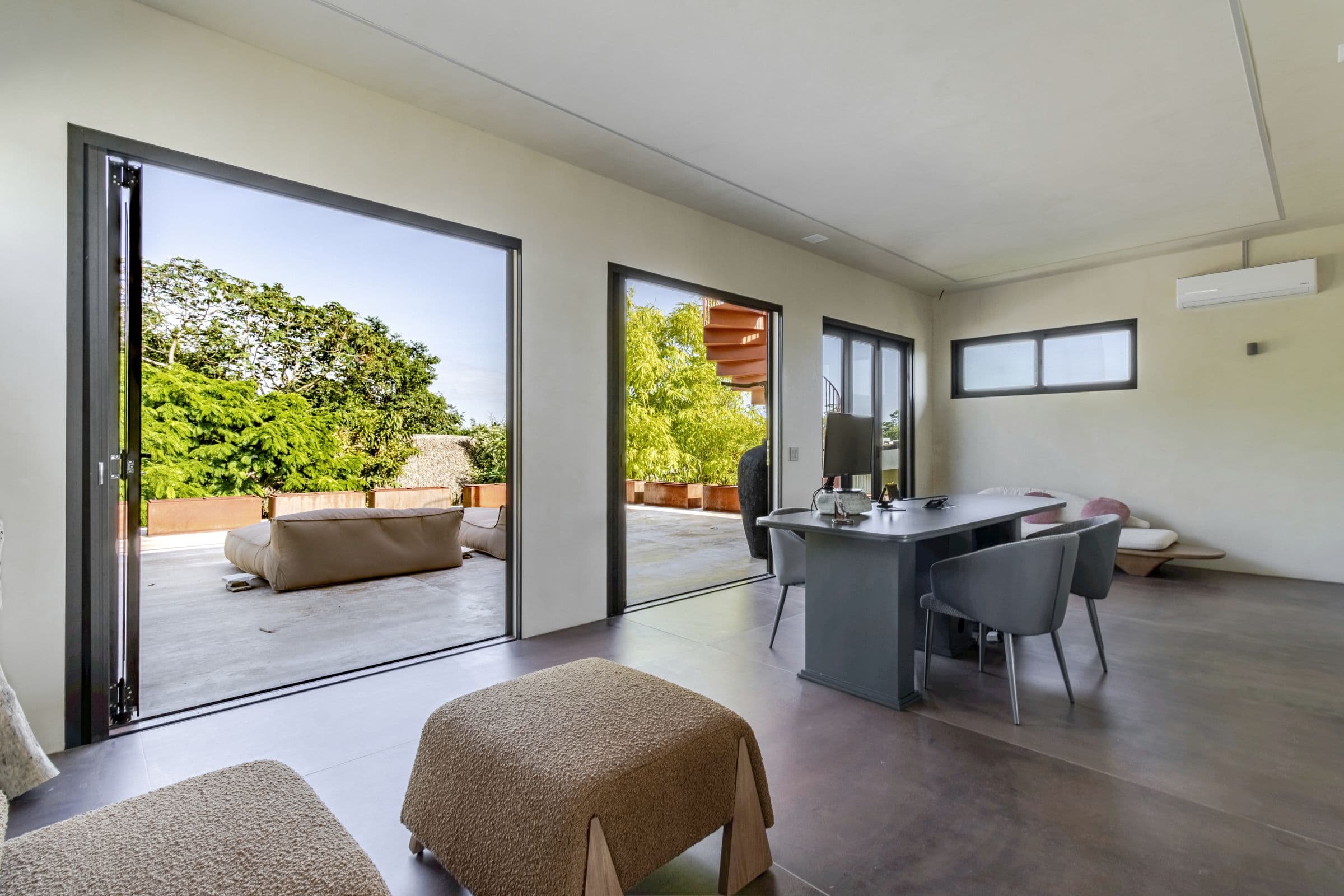 Upstairs lounge and desk opening onto the roof terrace